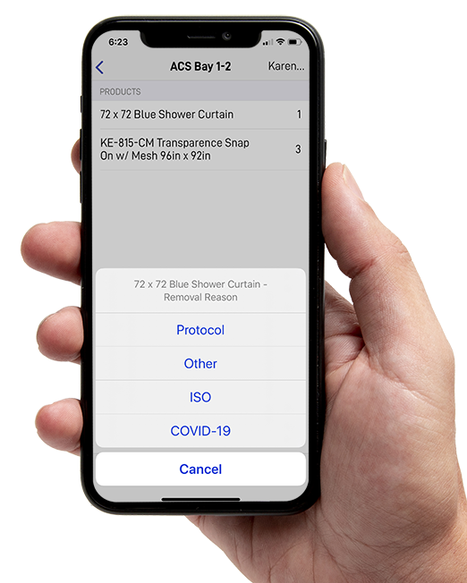 Hand holding phone with KleenEdge mobile application on the screen